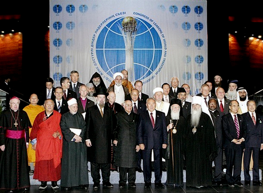 Kazakh President Nursultan Nazarbayev (C) and the participants of the II Congress of Leaders of World and Traditional religions pose for a family picture in Astana, 12 September 2006. A three-day forum on religious freedom and tolerance brings together more than 40 national delegations and as many international spiritual leaders in the capital of Kazakhstan. AFP PHOTO / STANISLAV FILIPPOV (Photo credit should read STANISLAV FILIPPOV/AFP/Getty Images)